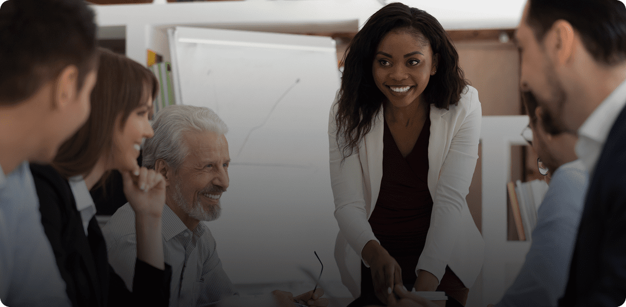 Group meeting with woman leading discussion.