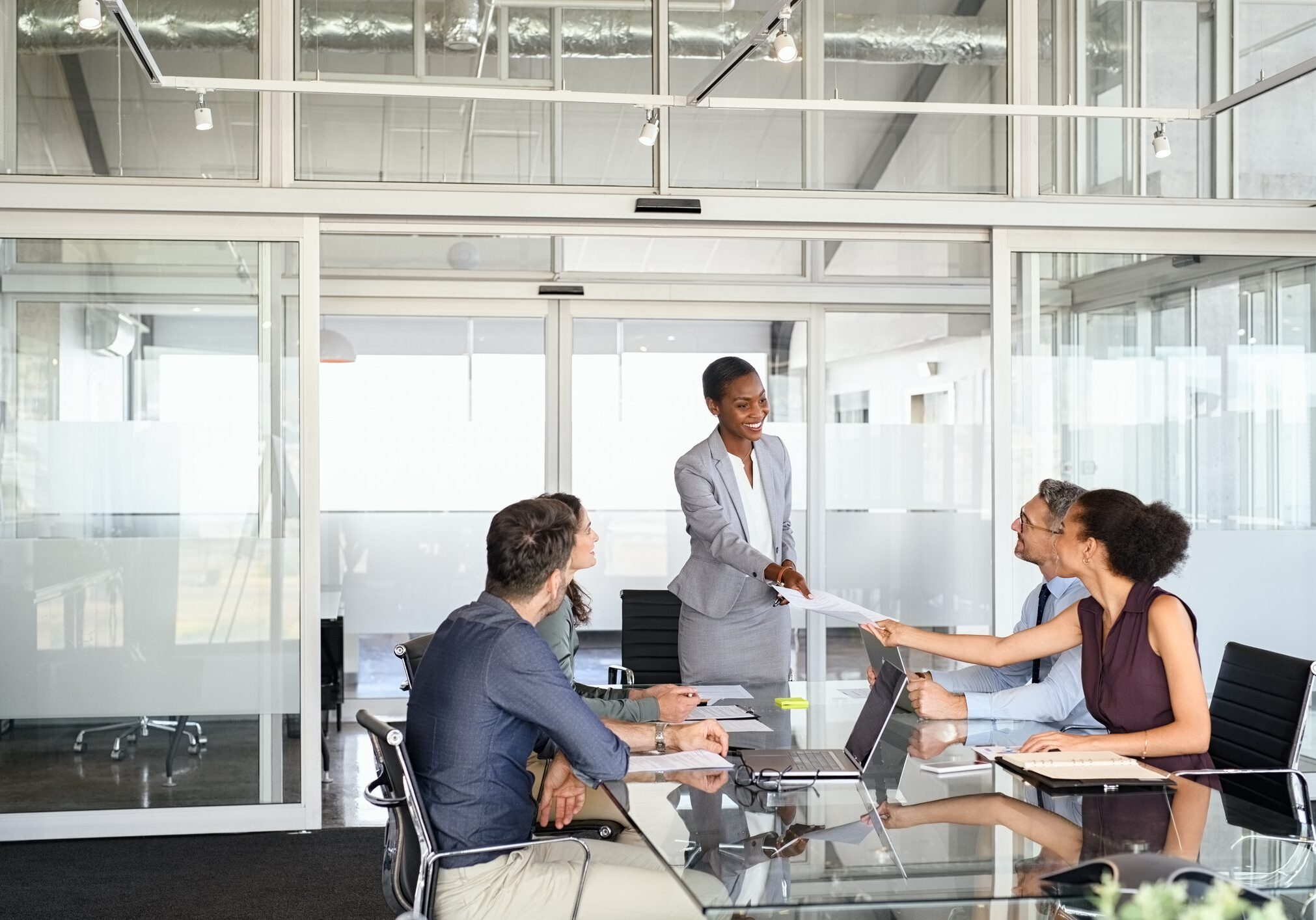 Business meeting in modern conference room.